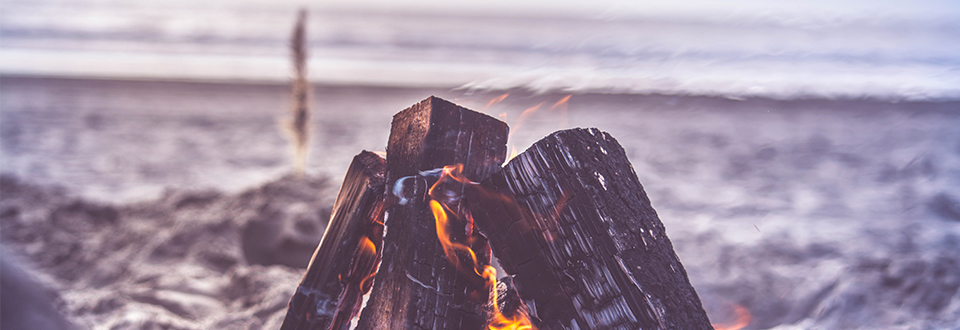 small bonfire on the beach